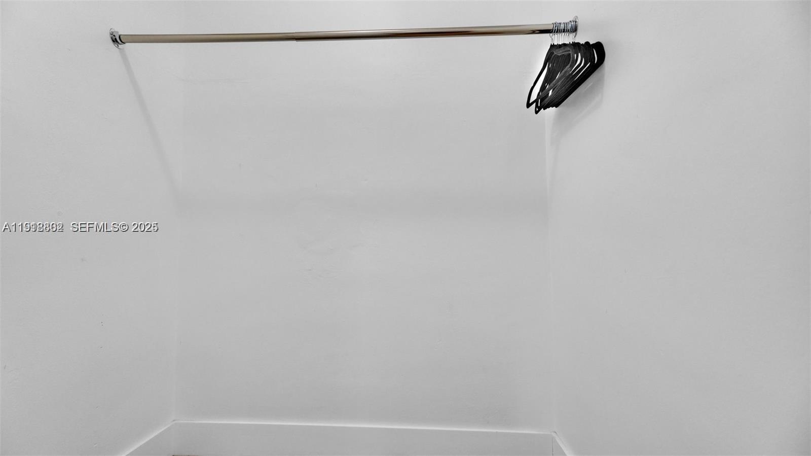 32 Southwest 9th Street, Unit 3 Hallandale Beach, FL 33009 - Photo 11 of 13 a view of small space with racks on the wall