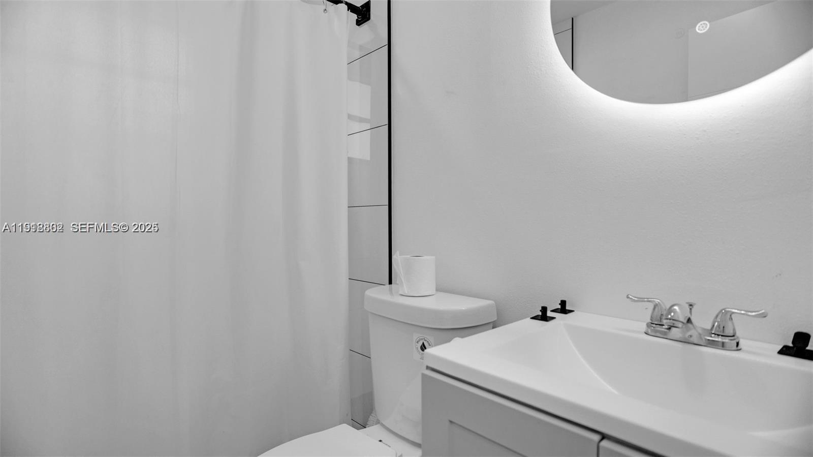 32 Southwest 9th Street, Unit 3 Hallandale Beach, FL 33009 - Photo 7 of 13 a bathroom with a sink and a toilet