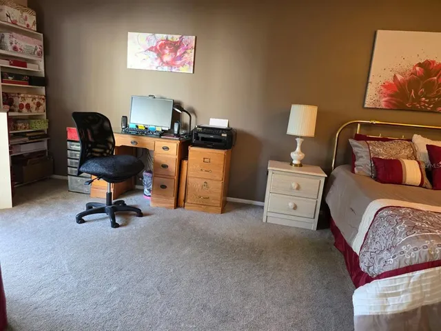 a bedroom with furniture and a bed