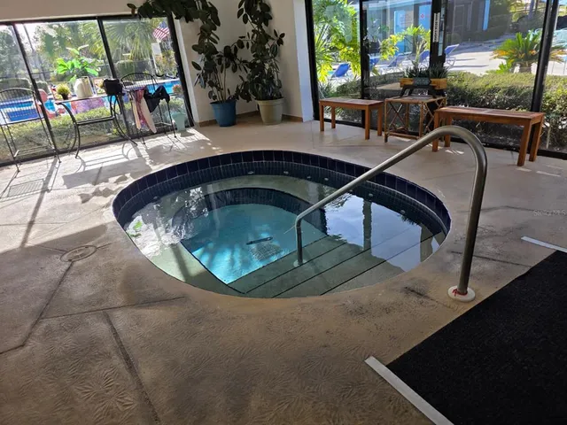 swimming pool view with a outdoor seating space