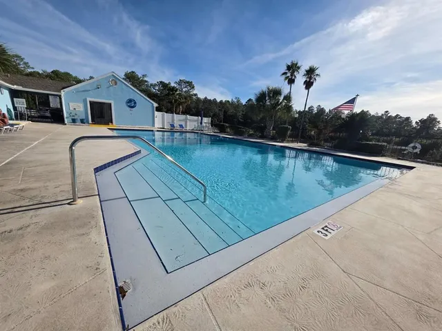 a view of a terrace with a lake view