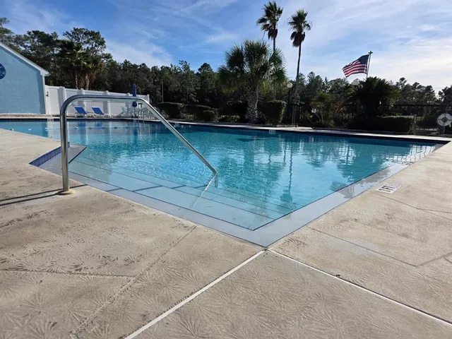 a view of a swimming pool with a lake view