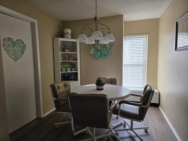 a dining room with furniture and window
