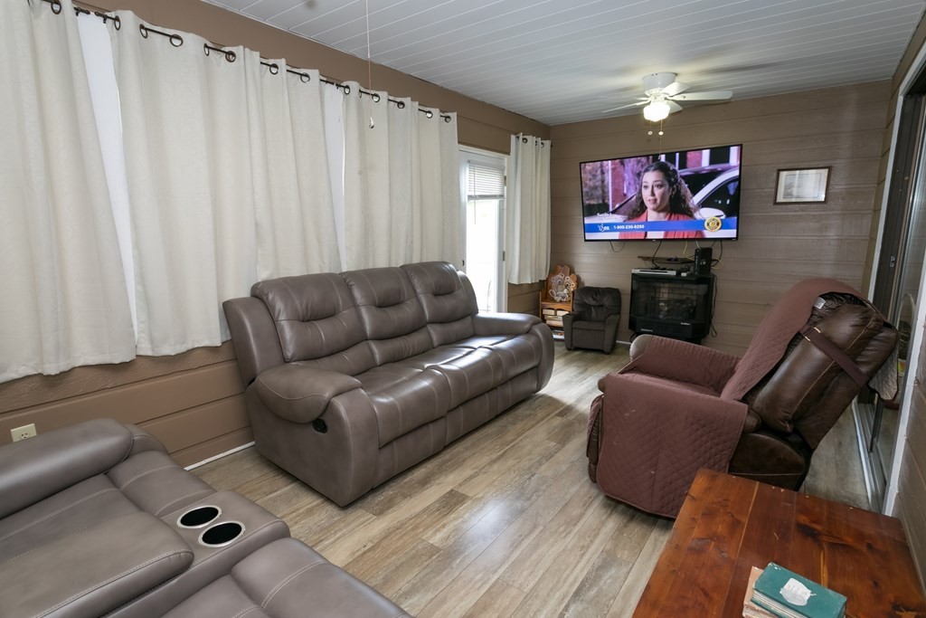 3108 Fortenberry Road Kodak, TN 37764 - Photo 8 of 47 a living room with furniture a projector and a flat screen tv