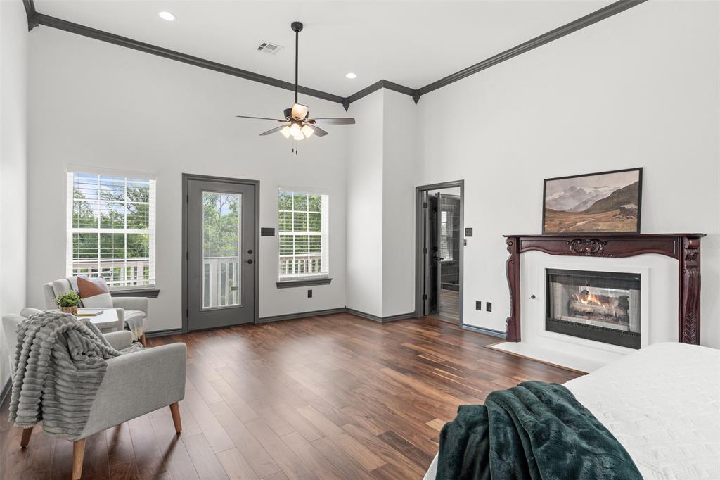 3091 Rockbridge Road McGregor, TX 76657 - Photo 25 of 40 a living room with furniture a fireplace and a flat screen tv