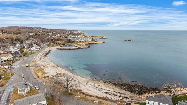 a kitchen with granite countertop white cabinets sink and stainless steel appliances