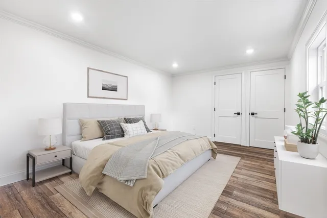 a bedroom with a large bed and a couch