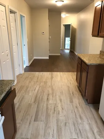 a view of a kitchen from the hallway