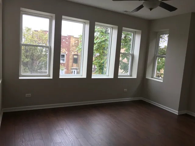 a view of room with window and hardwood floor