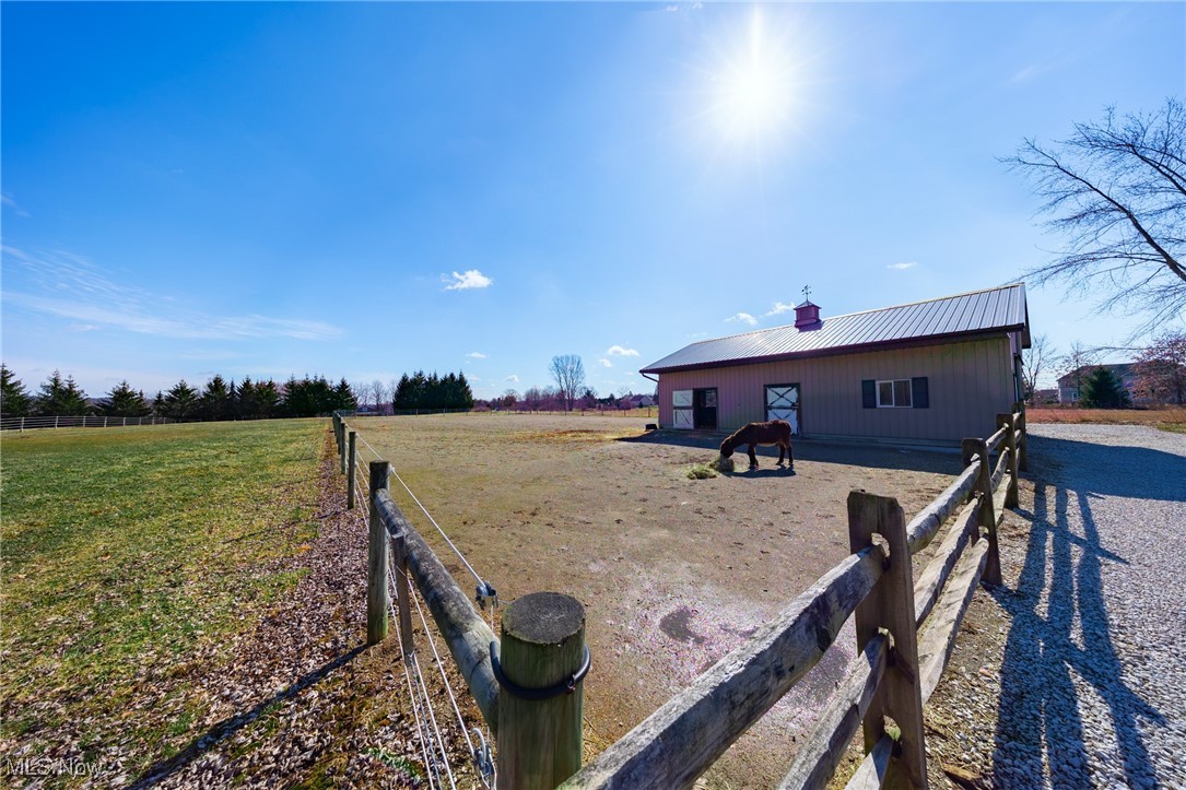 4515 State Road Medina, OH 44256 - Photo 31 of 36 Back of house with a rural view, metal roof, and an outdoor structure
