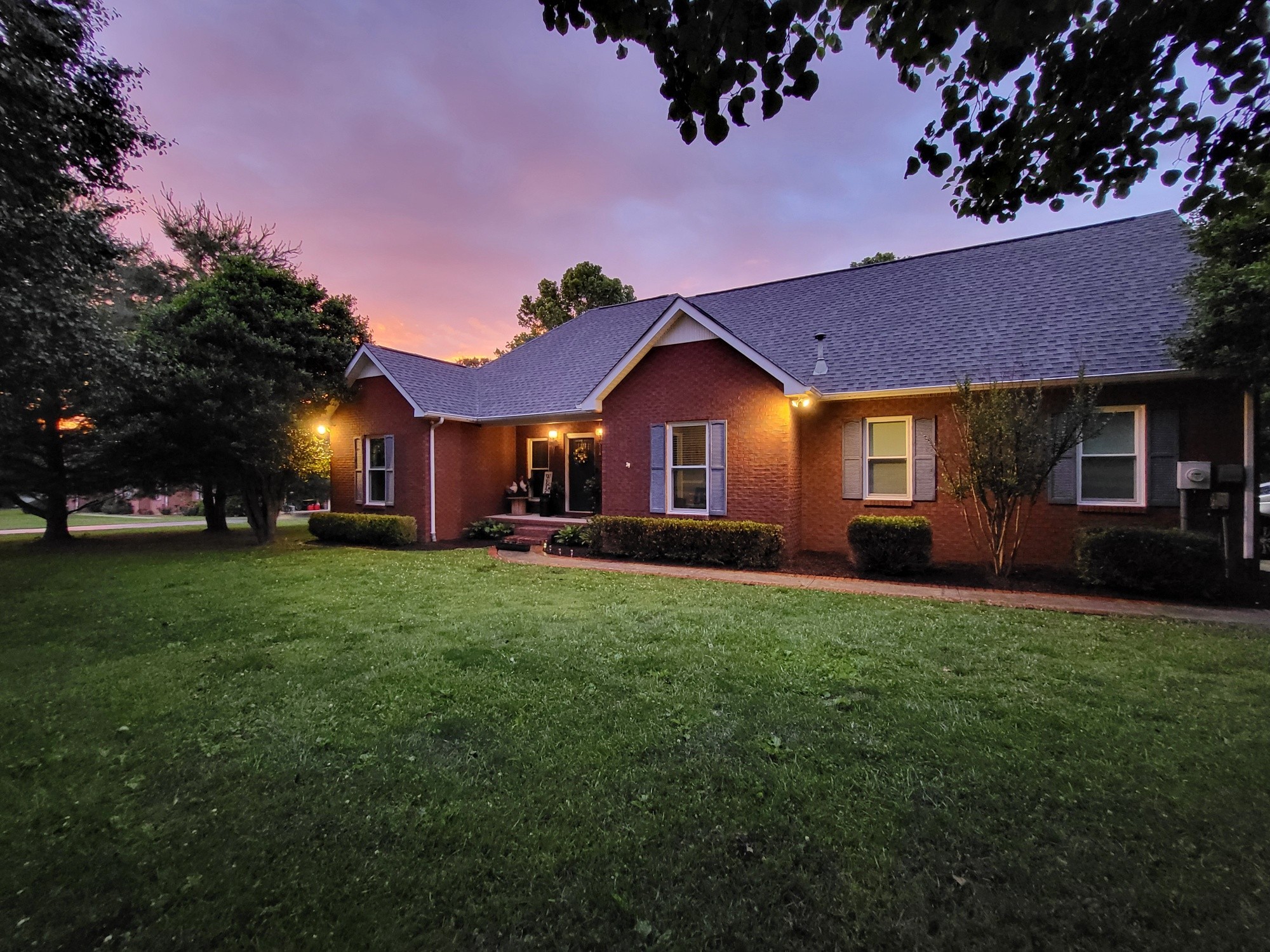 621 Brandon Road Manchester, TN 37355 - Photo 3 of 34 a front view of a house with a yard and trees