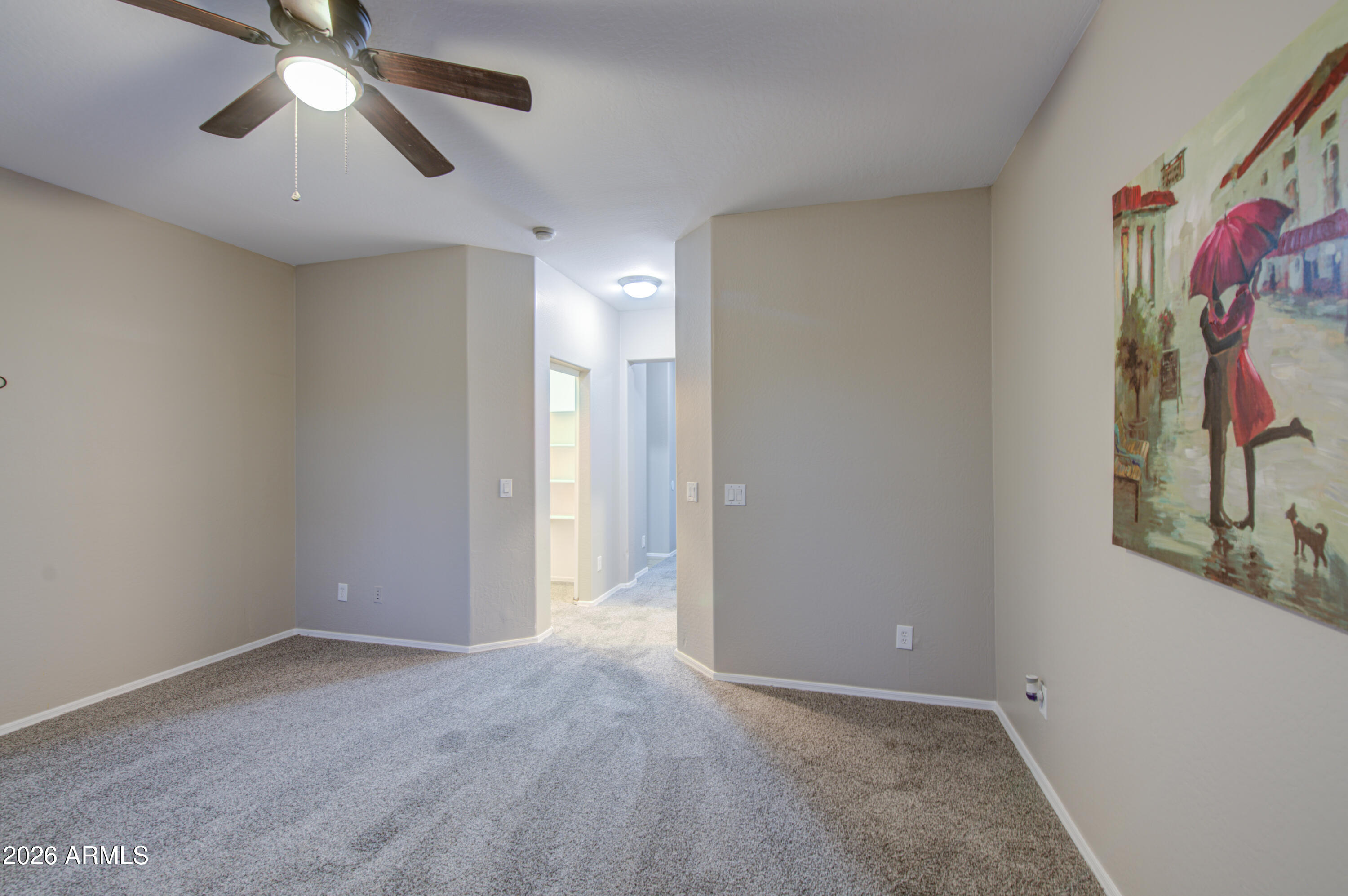 7759 West Monte Vista Road Phoenix, AZ 85035 - Photo 21 of 43 a view of a hallway with a chandelier fan