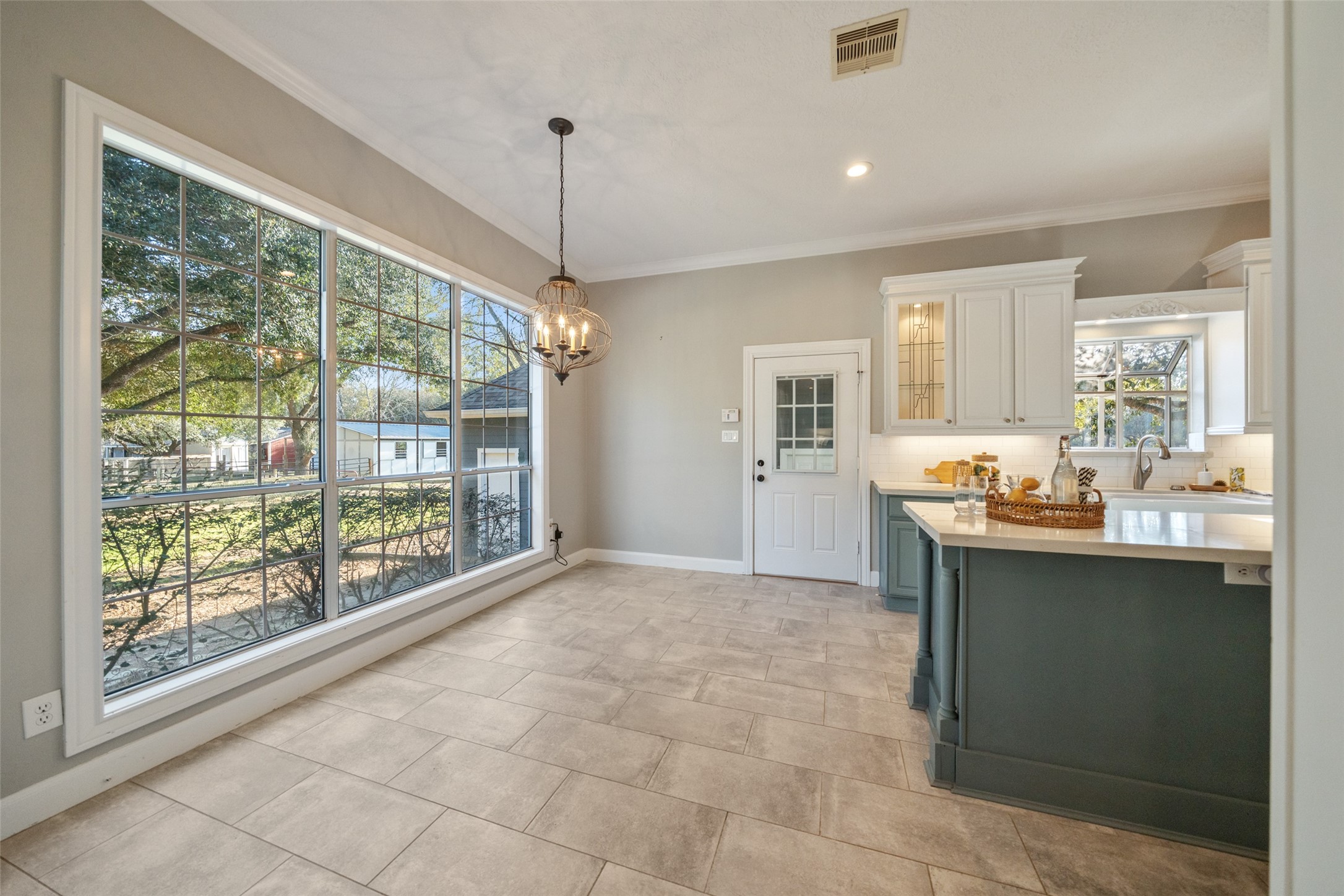 36003 Post Oak Circle Magnolia, TX 77355 - Photo 12 of 50 a large kitchen with kitchen island a sink stainless steel appliances and cabinets