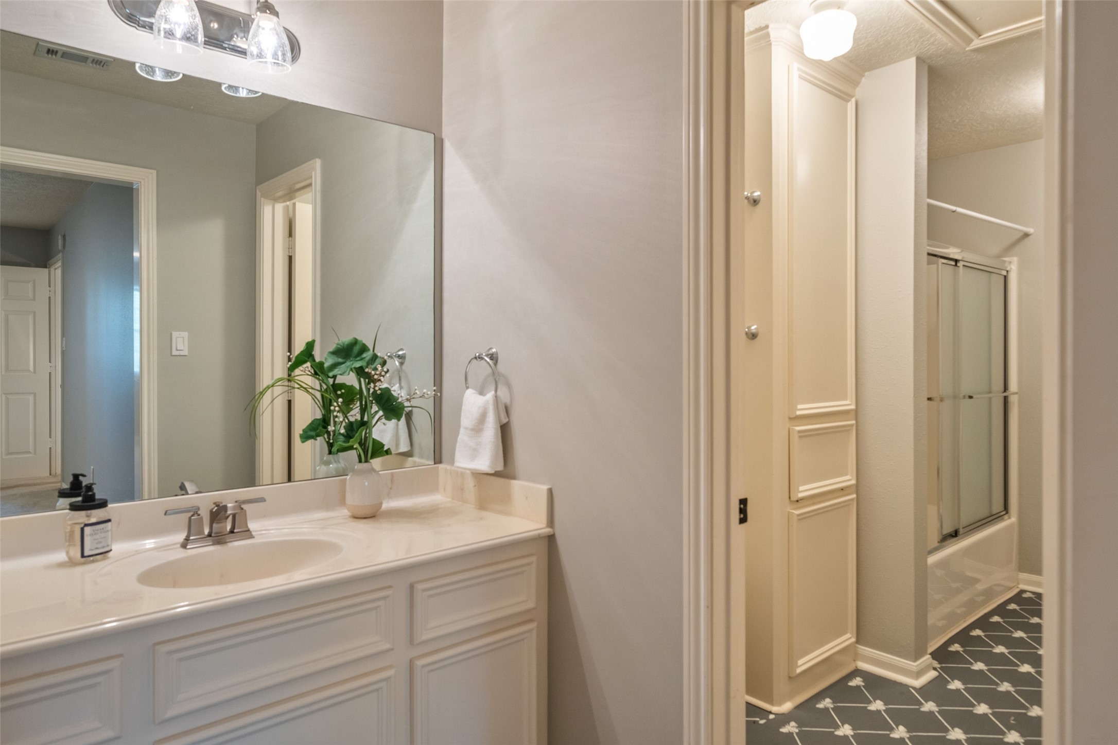 36003 Post Oak Circle Magnolia, TX 77355 - Photo 21 of 50 a bathroom with a double vanity sink mirror and shower