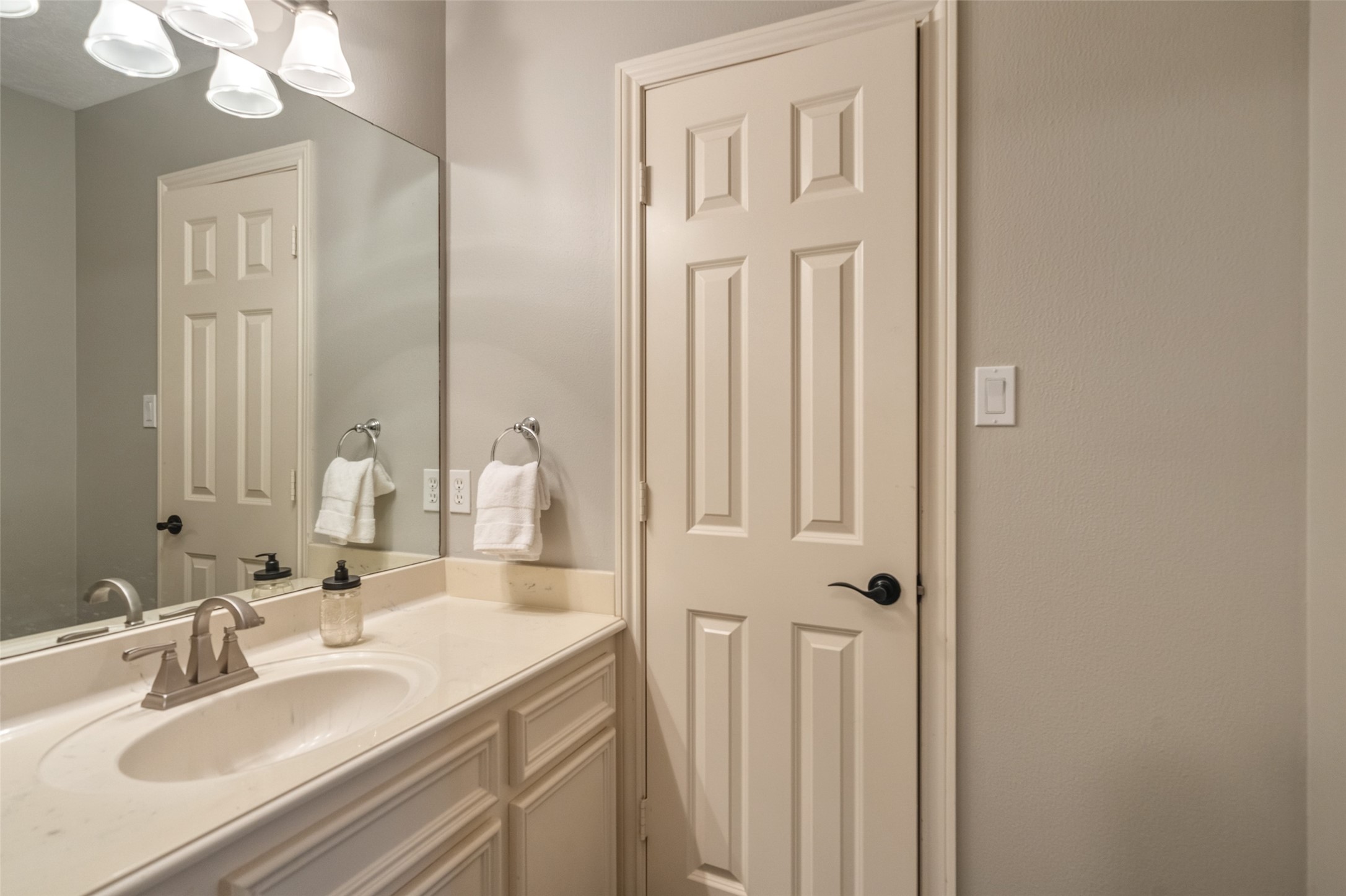 36003 Post Oak Circle Magnolia, TX 77355 - Photo 22 of 50 a bathroom with a sink vanity and a mirror