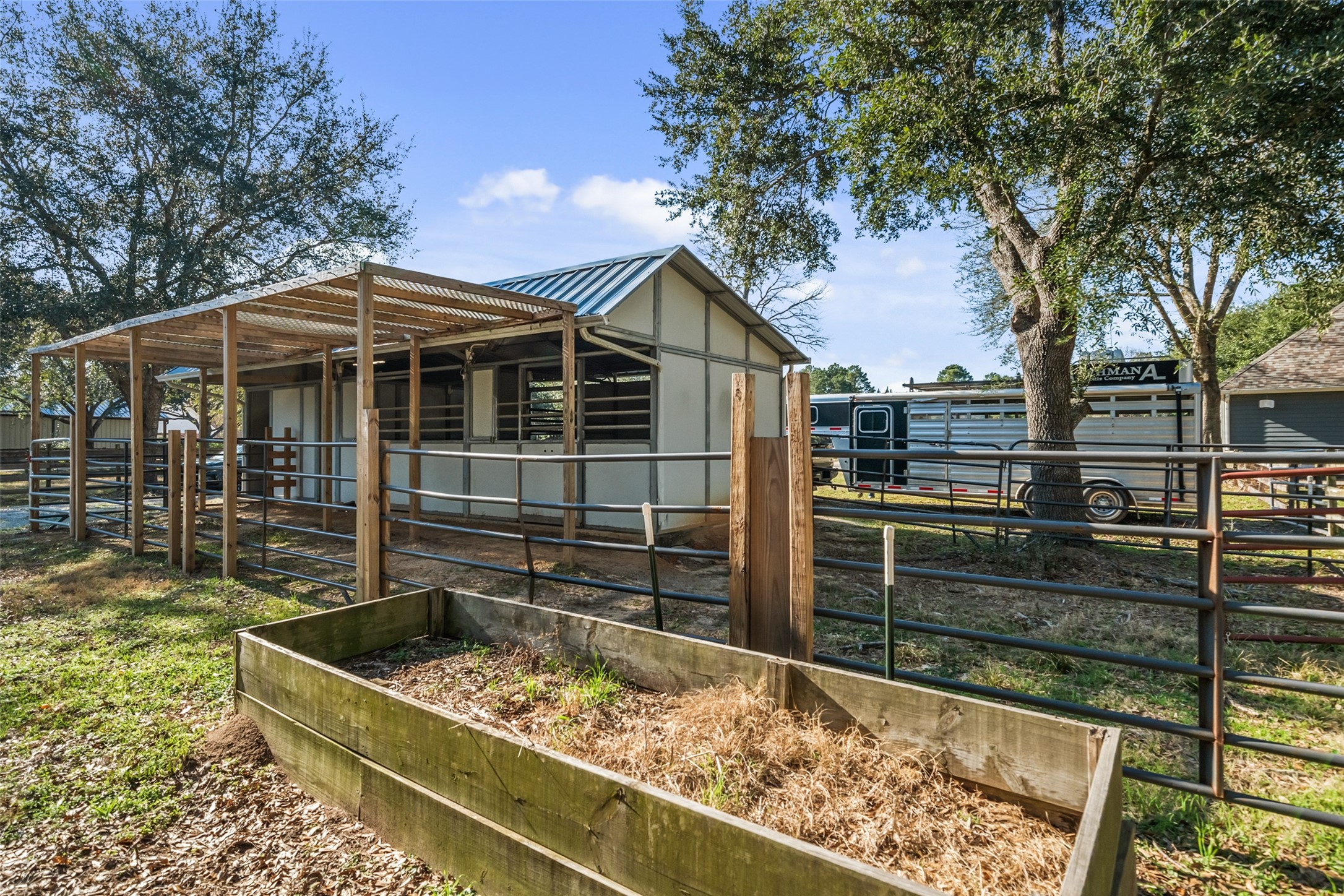 36003 Post Oak Circle Magnolia, TX 77355 - Photo 43 of 50 a view of a wooden house with a yard