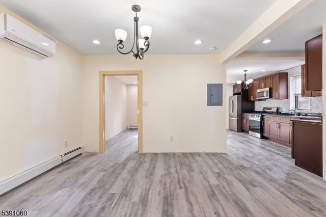 a view of a kitchen from the hallway
