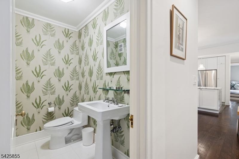 21 Hardwell Road Short Hills, NJ 07078 - Photo 32 of 50 a bathroom with a sink a toilet and shower curtain