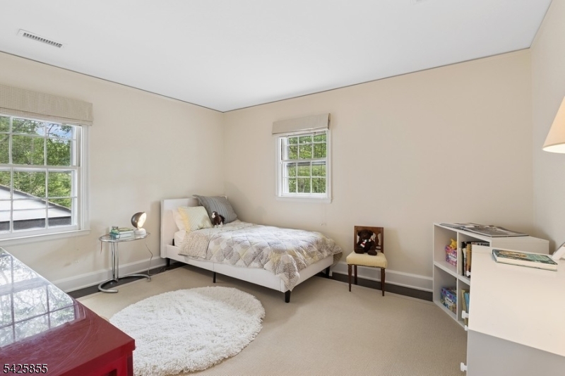 21 Hardwell Road Short Hills, NJ 07078 - Photo 39 of 50 a bedroom with a bed and a window