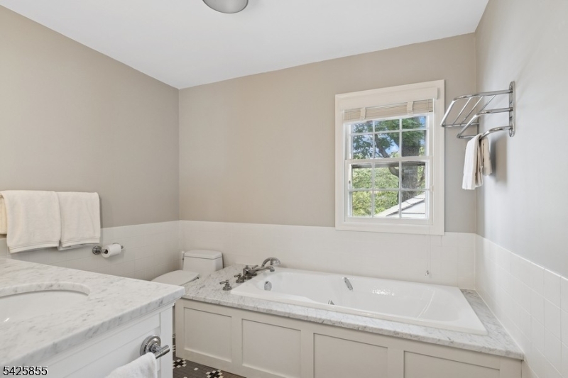 21 Hardwell Road Short Hills, NJ 07078 - Photo 40 of 50 a bathroom with a sink and a bathtub