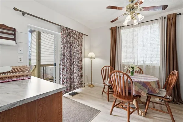 a view of a dining room with furniture and window