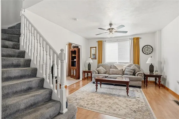 a living room with furniture and a rug