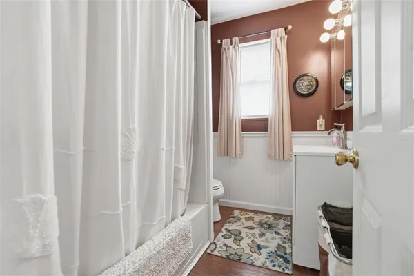 a bathroom with bathtub and shower