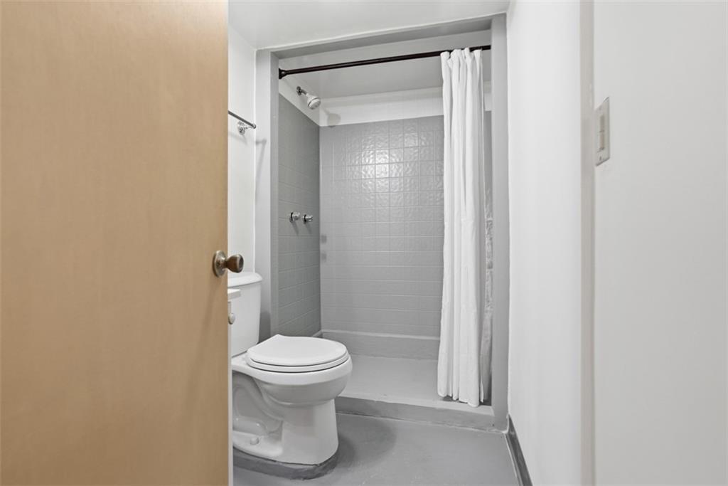 206 Third Street Pittsburgh, PA 15225 - Photo 22 of 25 a bathroom with a toilet and a shower