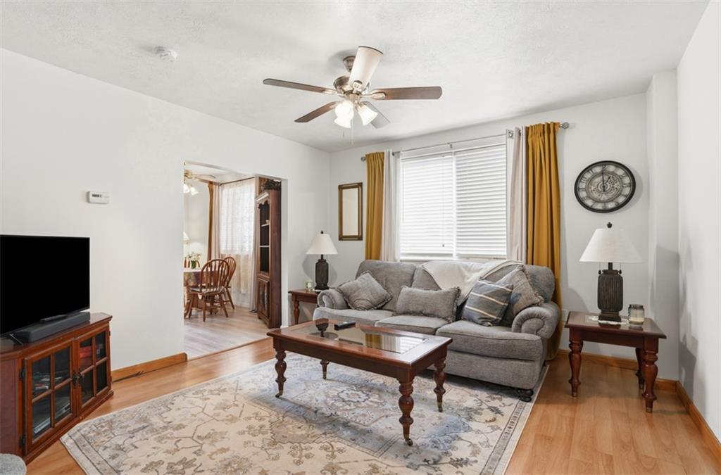 206 Third Street Pittsburgh, PA 15225 - Photo 6 of 25 a living room with furniture a rug and a flat screen tv