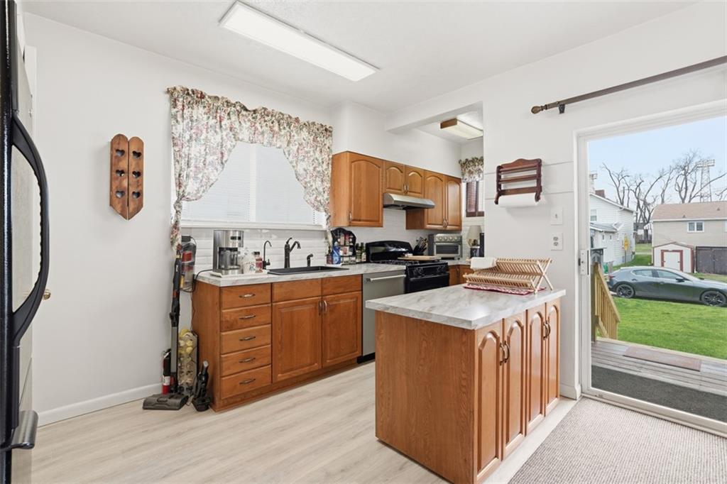 206 Third Street Pittsburgh, PA 15225 - Photo 10 of 25 a kitchen with stainless steel appliances granite countertop a sink and a stove