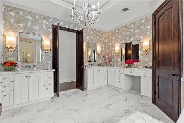 a bathroom with a sink vanity and mirror