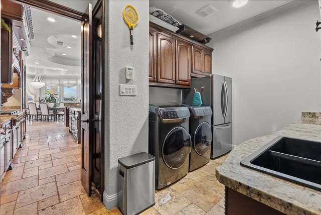 a utility room with dryer and washer