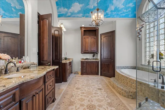a spacious bathroom with a sink double vanity and a mirror