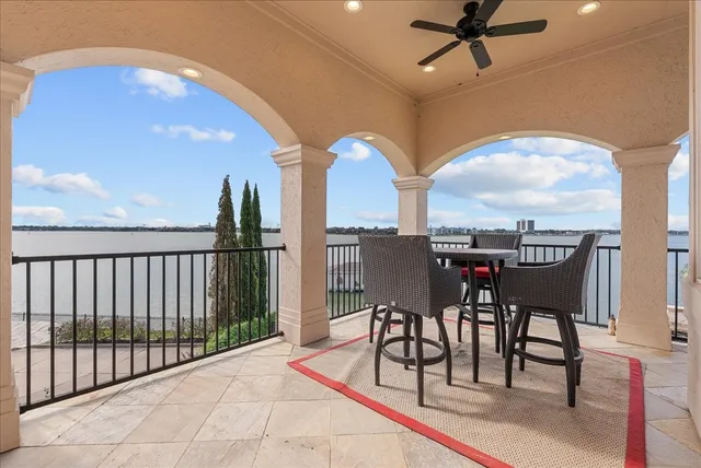 a view of a dining room with furniture and a floor to ceiling window
