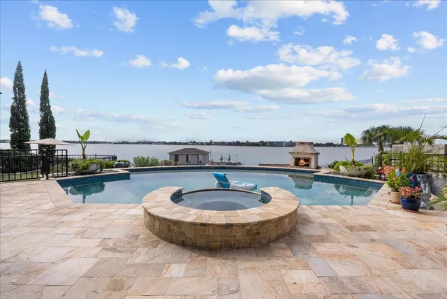 a view of a swimming pool with a table and chairs