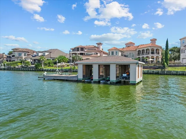 a front view of a house with a lake view
