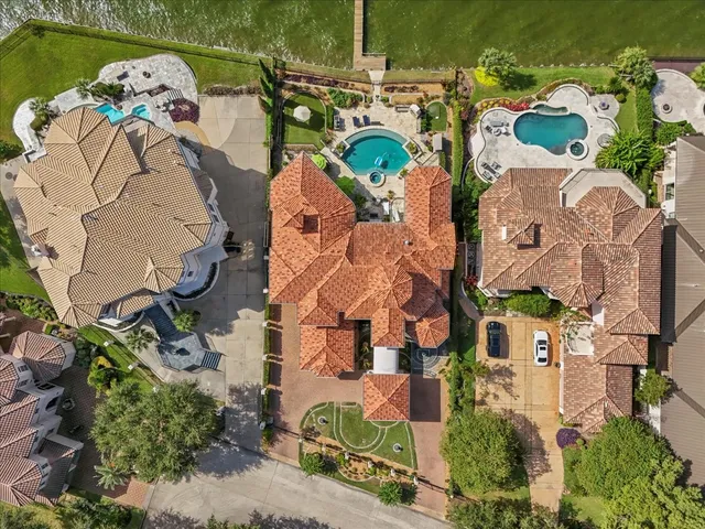 an aerial view of a house with a swimming pool