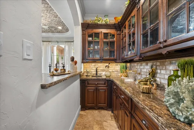 a kitchen with stainless steel appliances granite countertop a stove and a sink