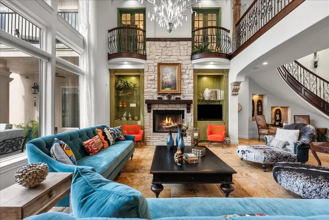 a living room with fireplace furniture and a fireplace