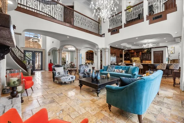 a living room with lots of furniture and a clock