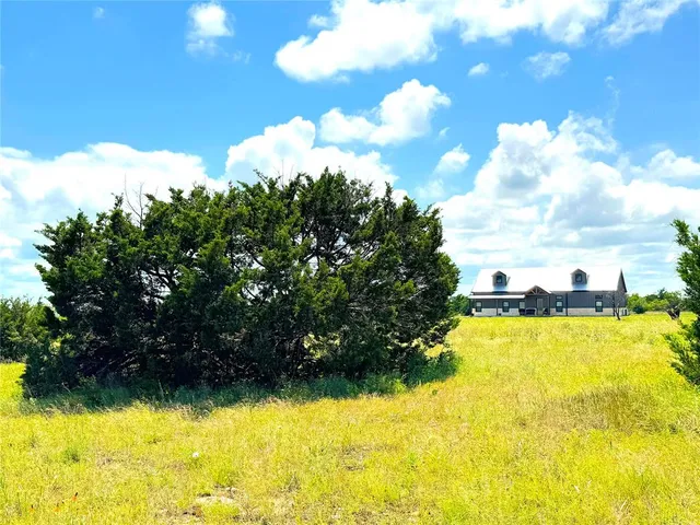 a view of a swimming pool with a yard
