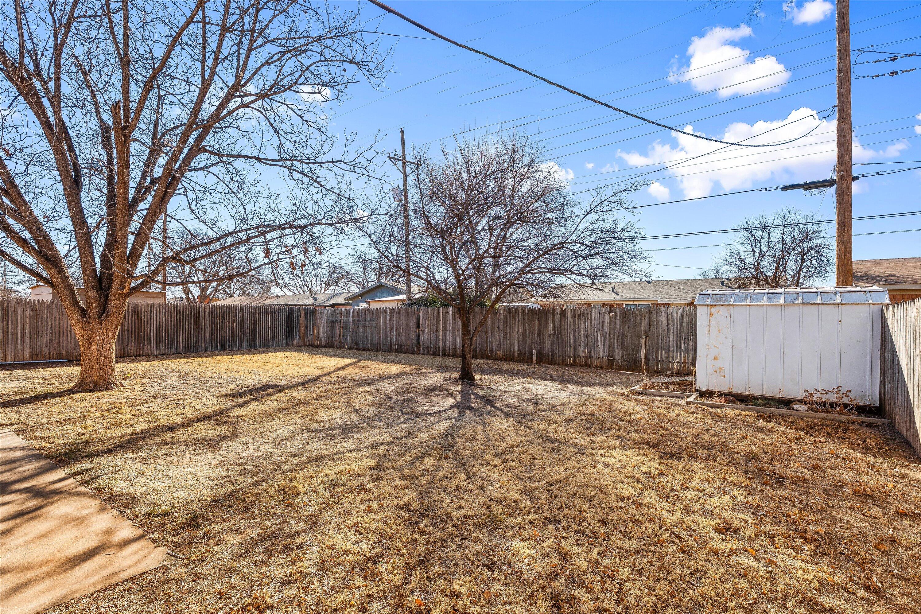 5519 17th Street Lubbock, TX 79416 - Photo 19 of 23 a backyard of a house