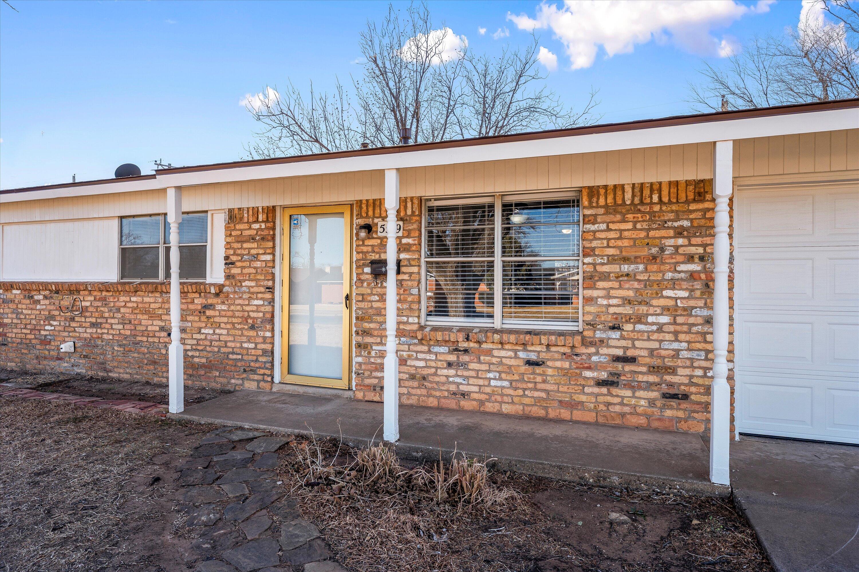 5519 17th Street Lubbock, TX 79416 - Photo 2 of 23 a front view of a house
