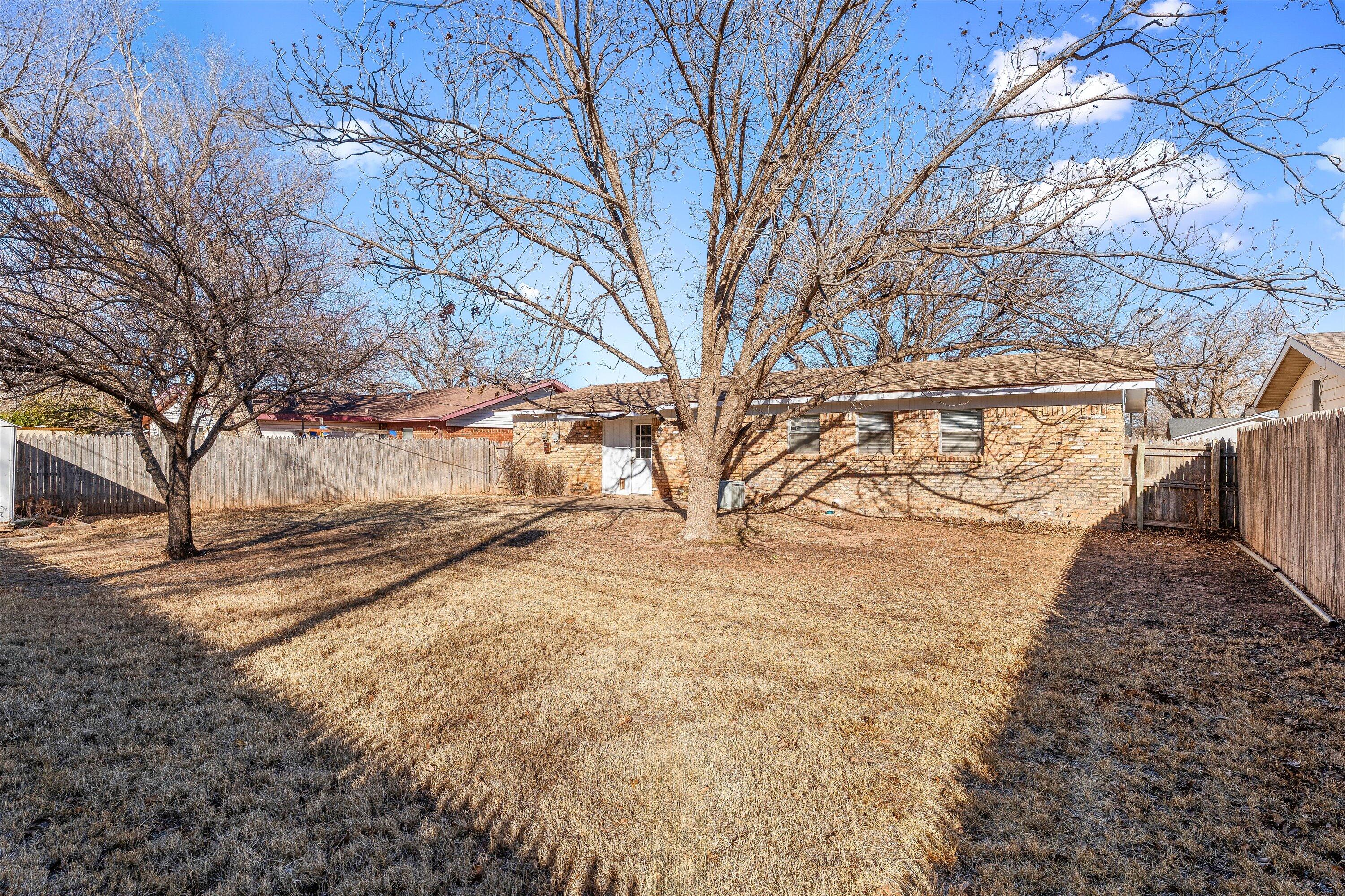 5519 17th Street Lubbock, TX 79416 - Photo 21 of 23 a view of a yard with a snow