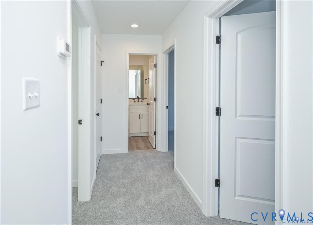 352 Ogden Street West Point, VA 23181 - Photo 14 of 29 a view of a hallway with closet and bathroom