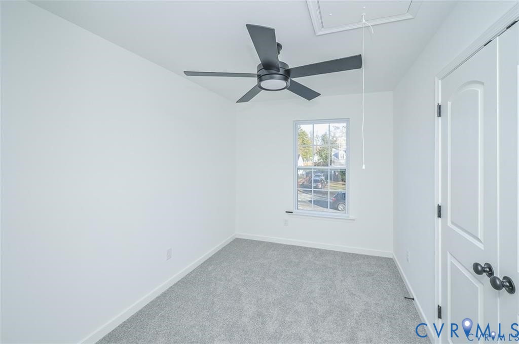 352 Ogden Street West Point, VA 23181 - Photo 21 of 29 an empty room with windows and fan