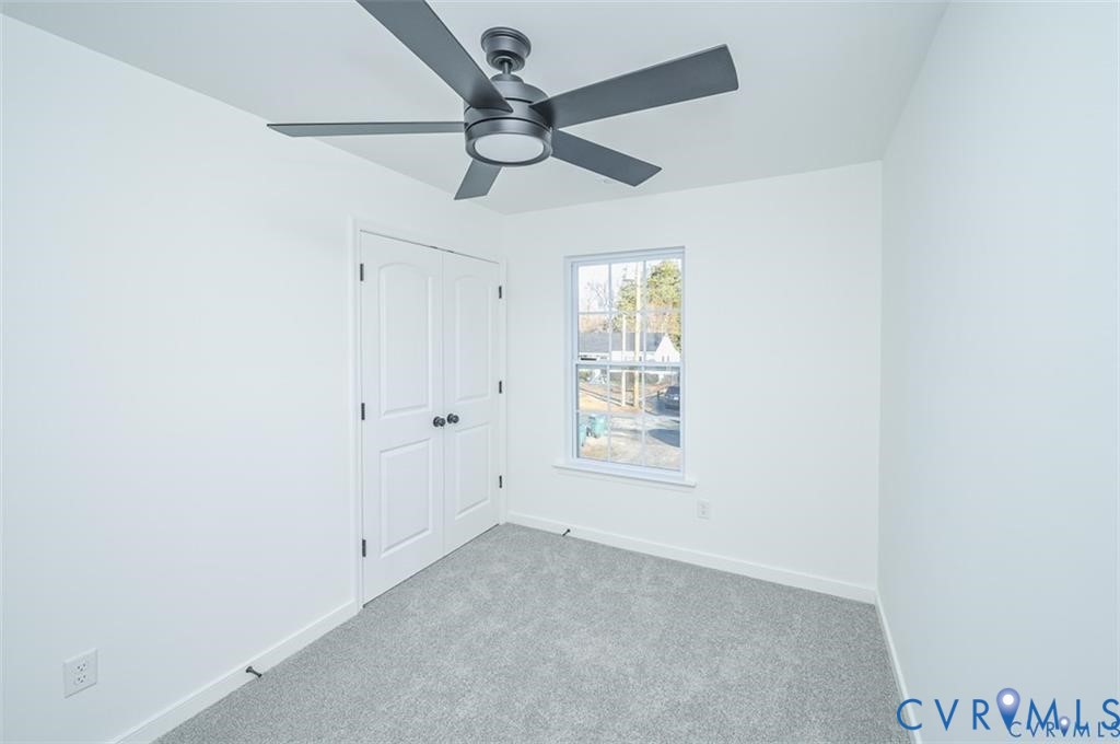 352 Ogden Street West Point, VA 23181 - Photo 25 of 29 an empty room with a window and a fan