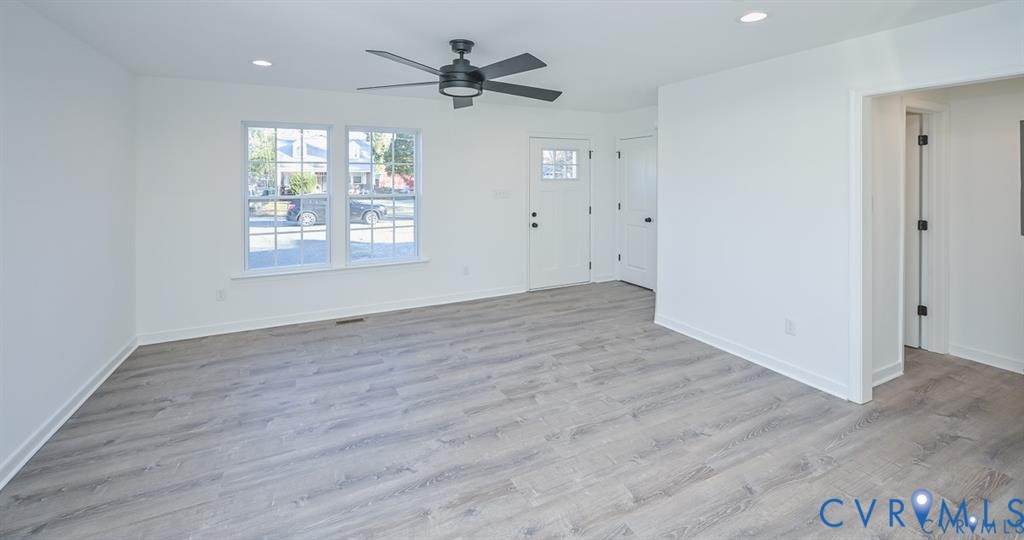 352 Ogden Street West Point, VA 23181 - Photo 4 of 29 wooden floor in an empty room with a window