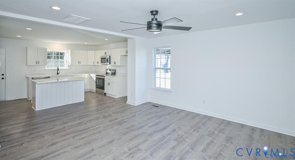 352 Ogden Street West Point, VA 23181 - Photo 5 of 29 a view of a kitchen with a sink dishwasher cabinets and a kitchen