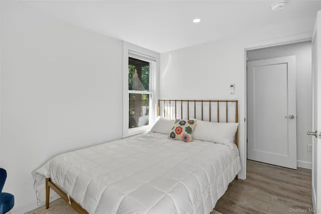 a bathroom with a granite countertop sink mirror toilet and bathtub
